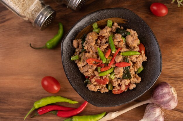 Spicy minced pork and rice on a black plate.