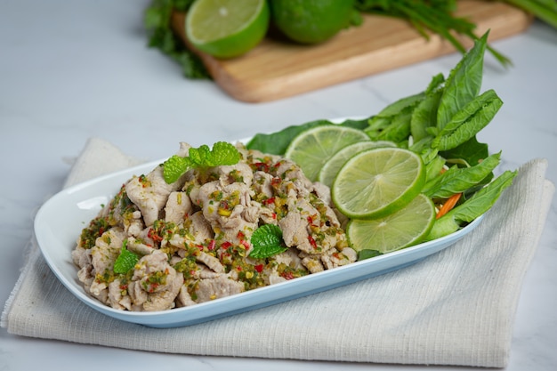 Spicy Pork Salad Served with fresh crispy kale stalks Thai food.