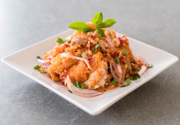 spicy salad with fried chicken