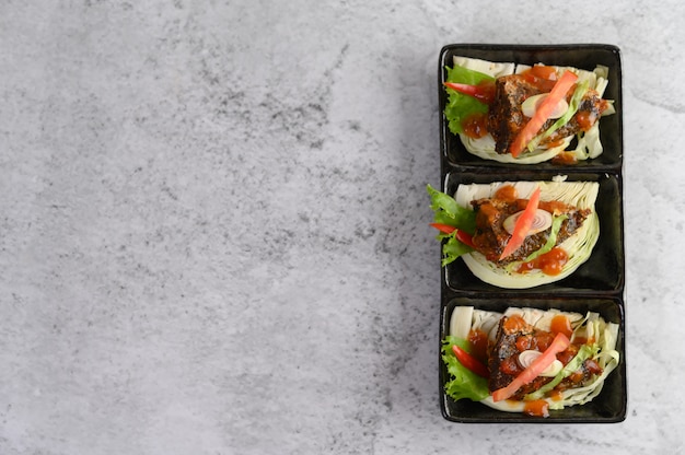 Spicy sardines in ceramic tray