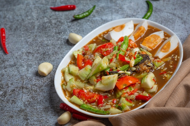 Spicy Thai salad with cucumbers and peppers in salted eggs.