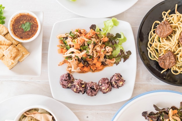 Spicy vegan salad with sticky berry and grain rice