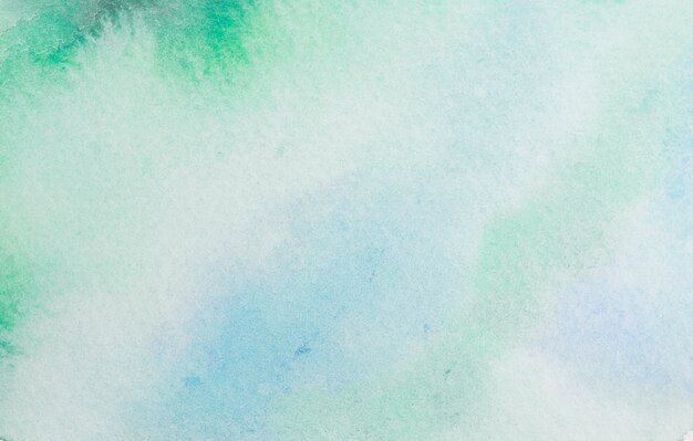 Spills of blue and green translucent dye