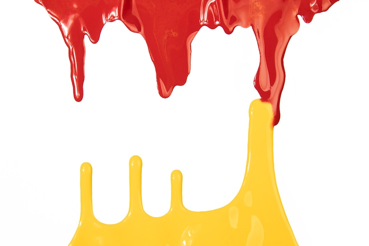 Free Photo spills of yellow and red paint
