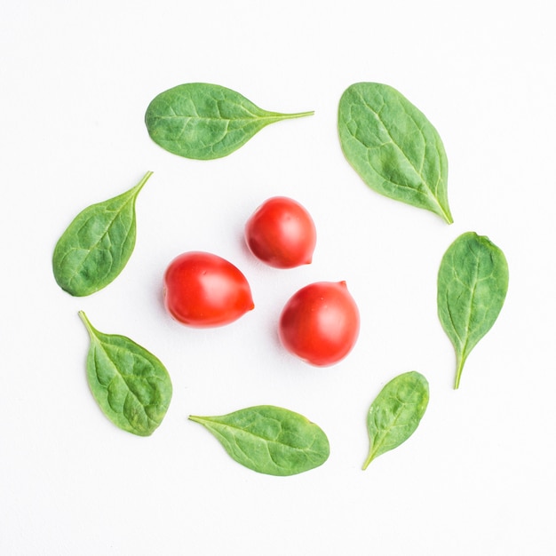 Spinach around cherry tomatoes