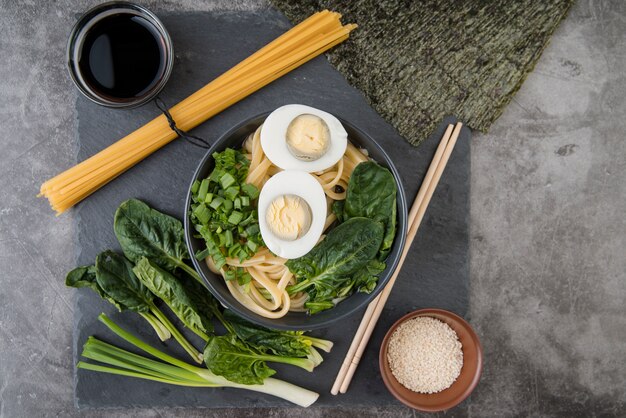 Spinach and eggs ramen soup with soy sauce