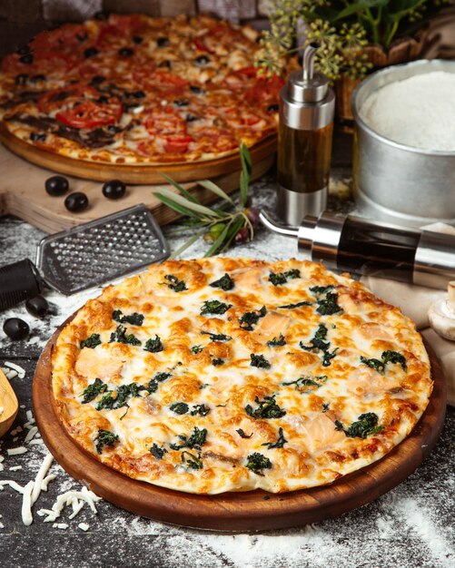 Spinach pizza covered with cheese