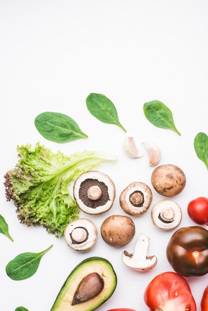 Spinach and vegetables around mushrooms