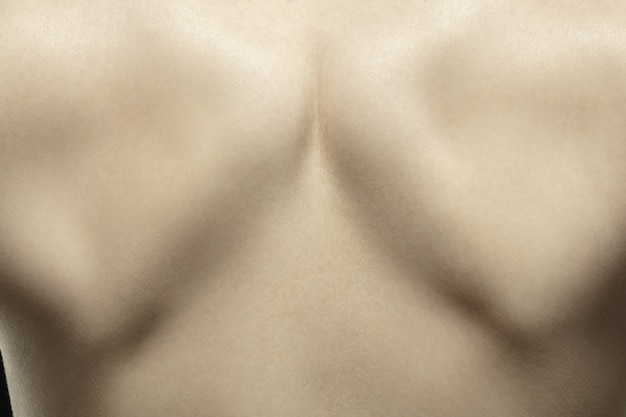 Spine. Detailed texture of human skin. Close up shot of young caucasian female body.