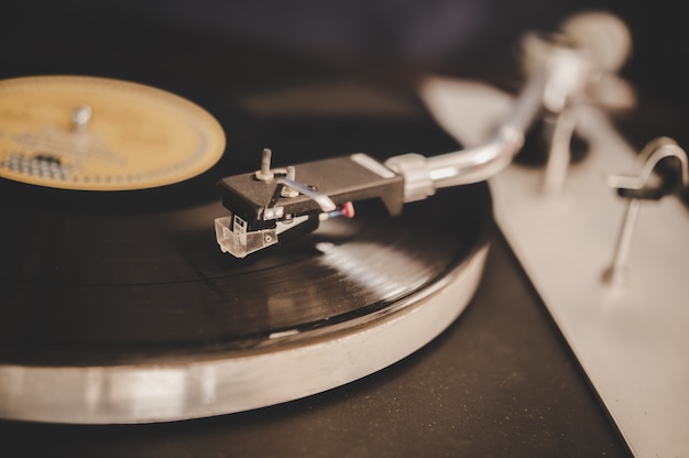 Spinning record player with vintage vinyl