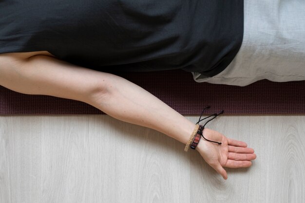 Spiritual young man practicing yoga indoors