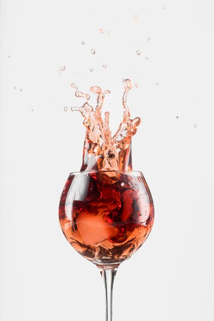 Splash of red wine in a glass