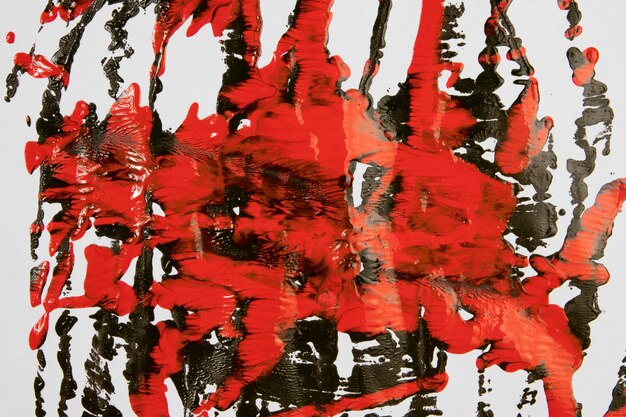 Splashes of red and black paint