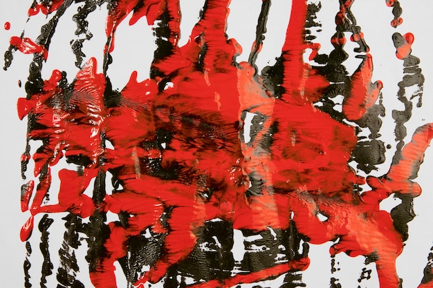 Splashes of red and black paint