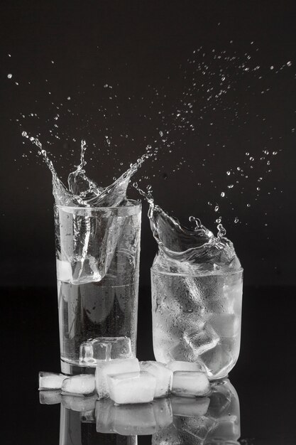 Splashes of water in transparent glasses