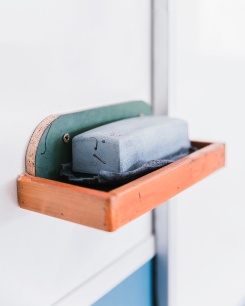 Sponge for erasing chalk on board shelf