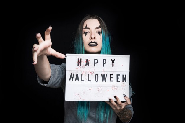 Spooky female with signboard