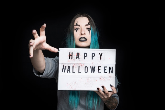 Spooky female with signboard