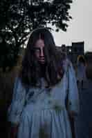 Free photo spooky female zombie outdoors