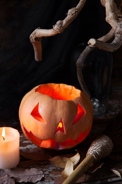 Free photo spooky halloween carved pumpkin lantern