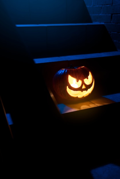 Spooky halloween pumpkin on stairs