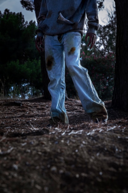 Free photo spooky male zombie outdoors