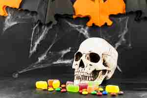 Free photo spooky skull and colorful candies