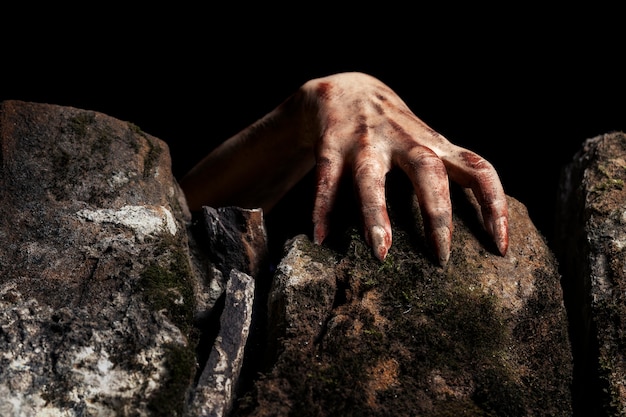 Free photo spooky zombie hand in nature