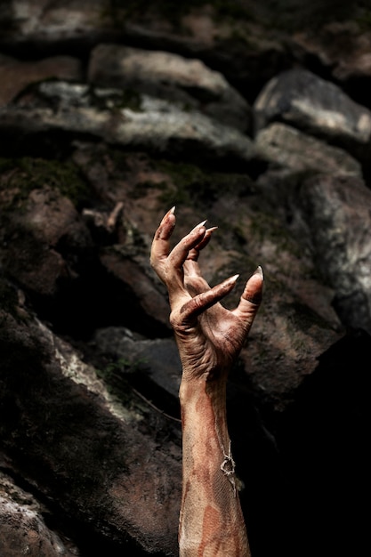 Spooky zombie hand in nature