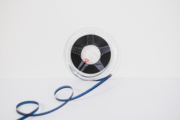 Spool with filmstrip on white