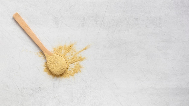 Free photo spoon filled with sand