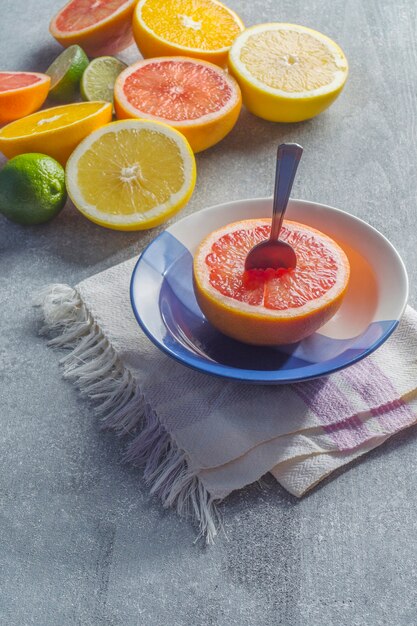 Free photo spoon in grapefruit