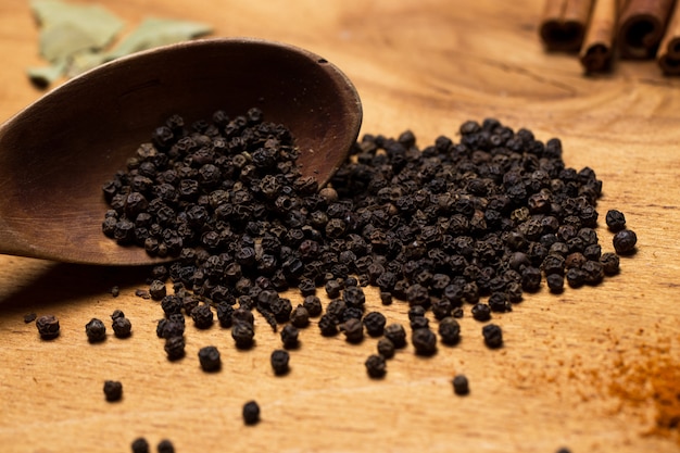 Free photo spoon and heap of spices on the table