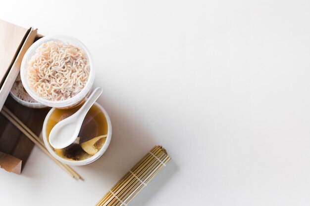 Spoon on plastic containers with food