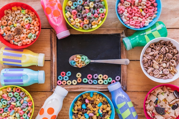 Spoon with cereal on chalkboard