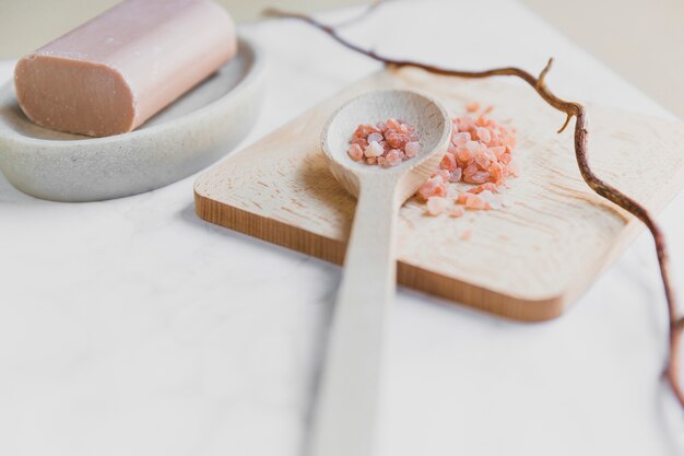 Free photo spoon with salt near soap