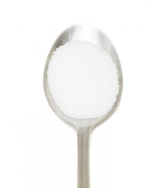 Spoon with salt and white background