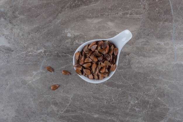 A spoonful of tasty kernel on the marble surface