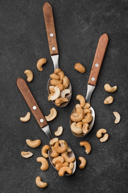 Free photo spoons with healthy raw cashew nuts