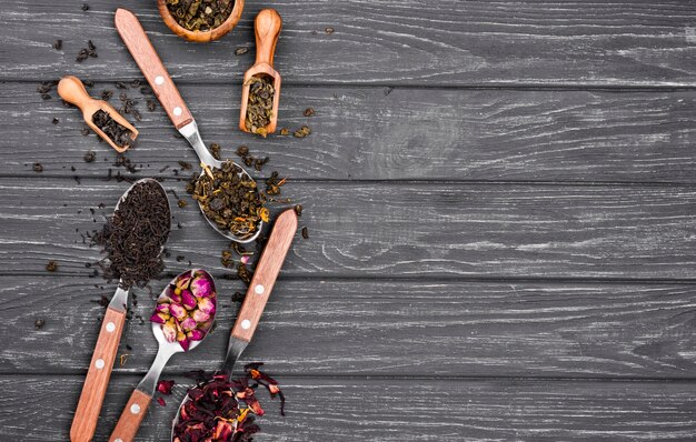 Spoons with herbal tea with copy-space