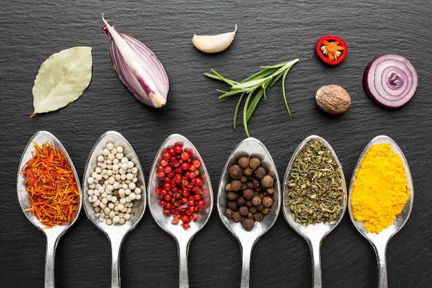 Spoons with powder condiments on table