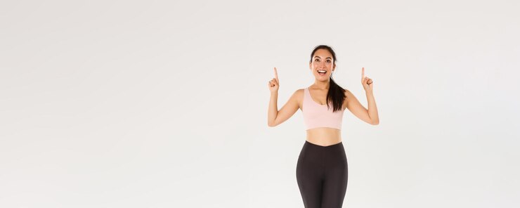 Free Photo sport gym and healthy body concept full length of excited smiling female athlete in sportswear looki