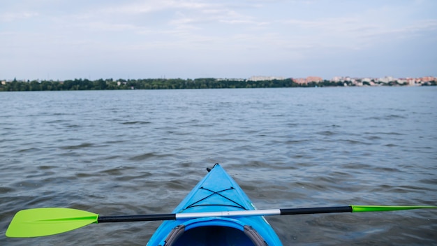 Sport kayak on the rocky lake shore