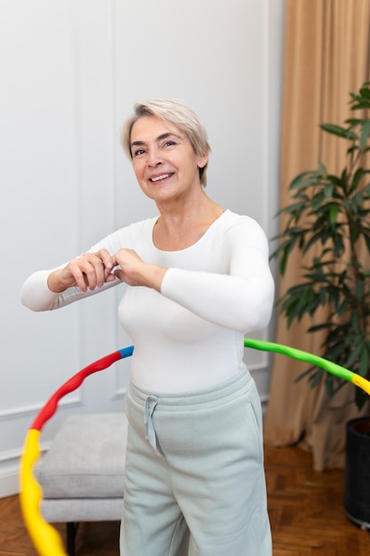 Sport person training with hula hoop