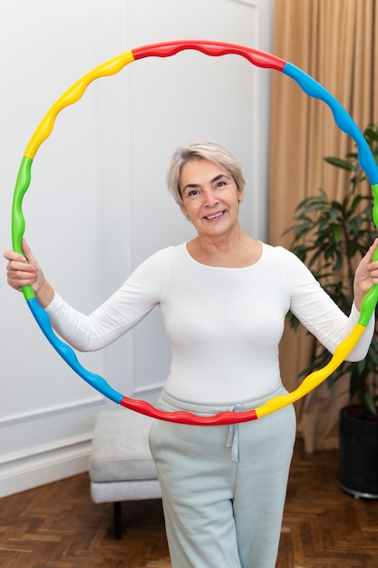 Sport person training with hula hoop
