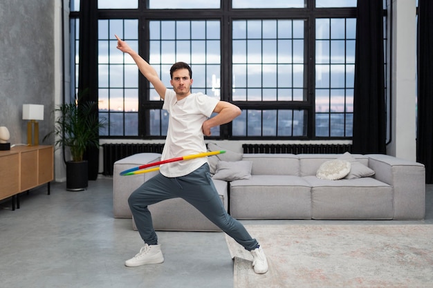 Free photo sport person training with hula hoop