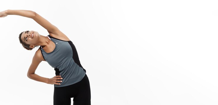 Free Photo sport training lifestyle and fitness concept portrait of beautiful happy african american woman stretching hands isolated on white studio background