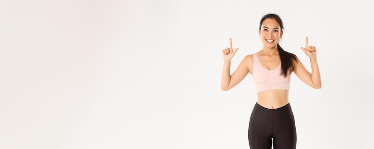 Free Photo sport wellbeing and active lifestyle concept cheerful goodlooking asian sportswoman in sportsbra and
