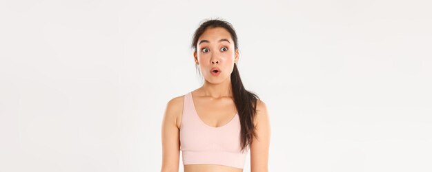 Sport wellbeing and active lifestyle concept closeup of excited and amazed asian fitness girl cute b