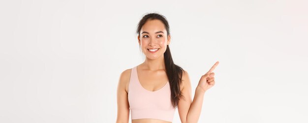 Sport wellbeing and active lifestyle concept closeup of smiling attractive asian fitness girl female